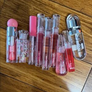 Bundle x 9 assorted Hard Candy Glossy Lip Collection - Pink and Clear